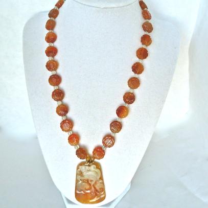 C3362 carved bi-color orange jade dragon, carved carnelian bead necklace